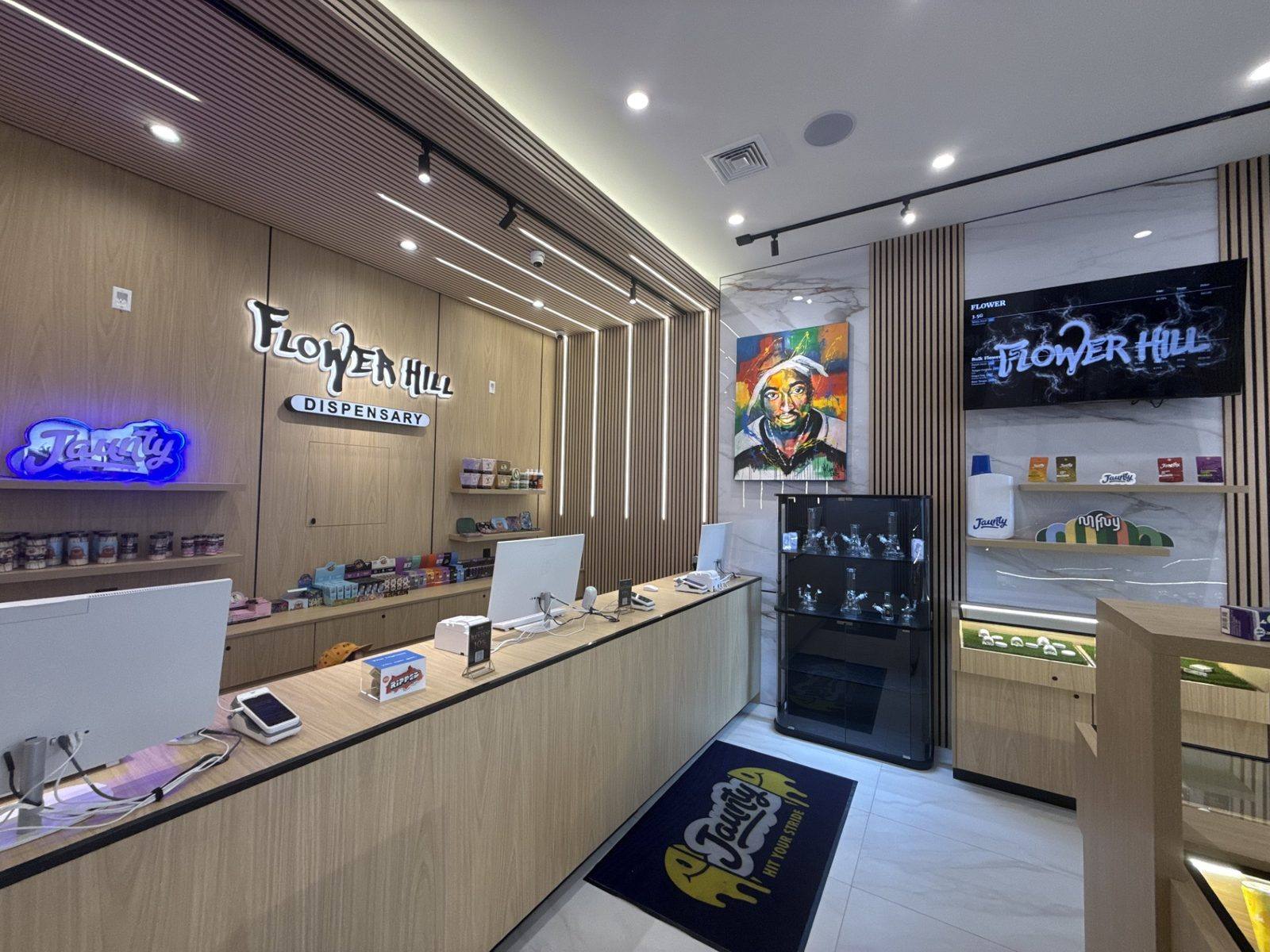 Flower Hill Dispensary checkout counter and branded product wall